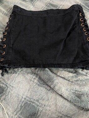 Tennis Brand Black denim mini skirt with lace-up detail. Size 10